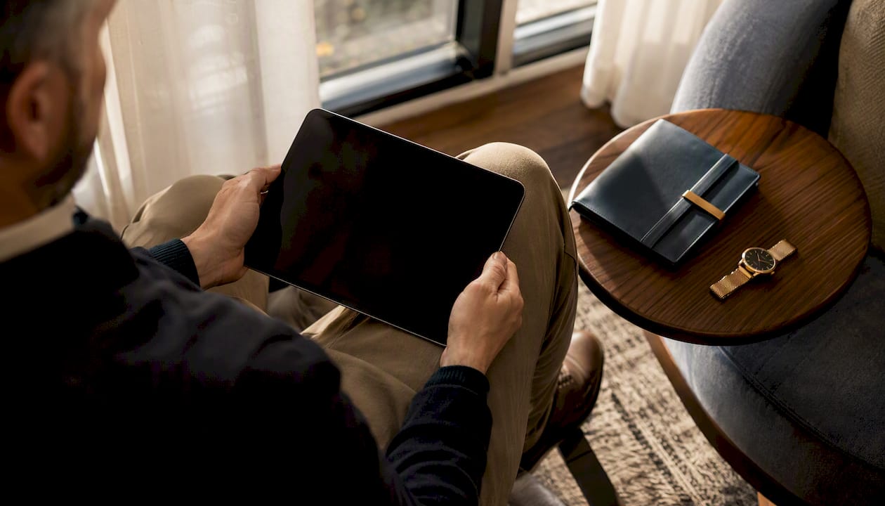 1786373505303_Hands-holding-tablet-reviewing-medical-insurance Hands holding tablet reviewing medical insurance